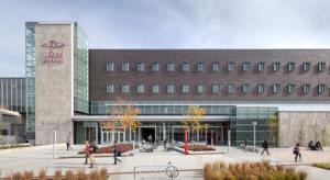 Aerospace and Engineering Sciences Building exterior on a sunny day with students walking